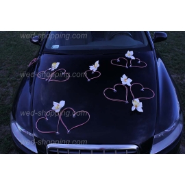 Roze hartjes witte orchideeën voor trouwauto